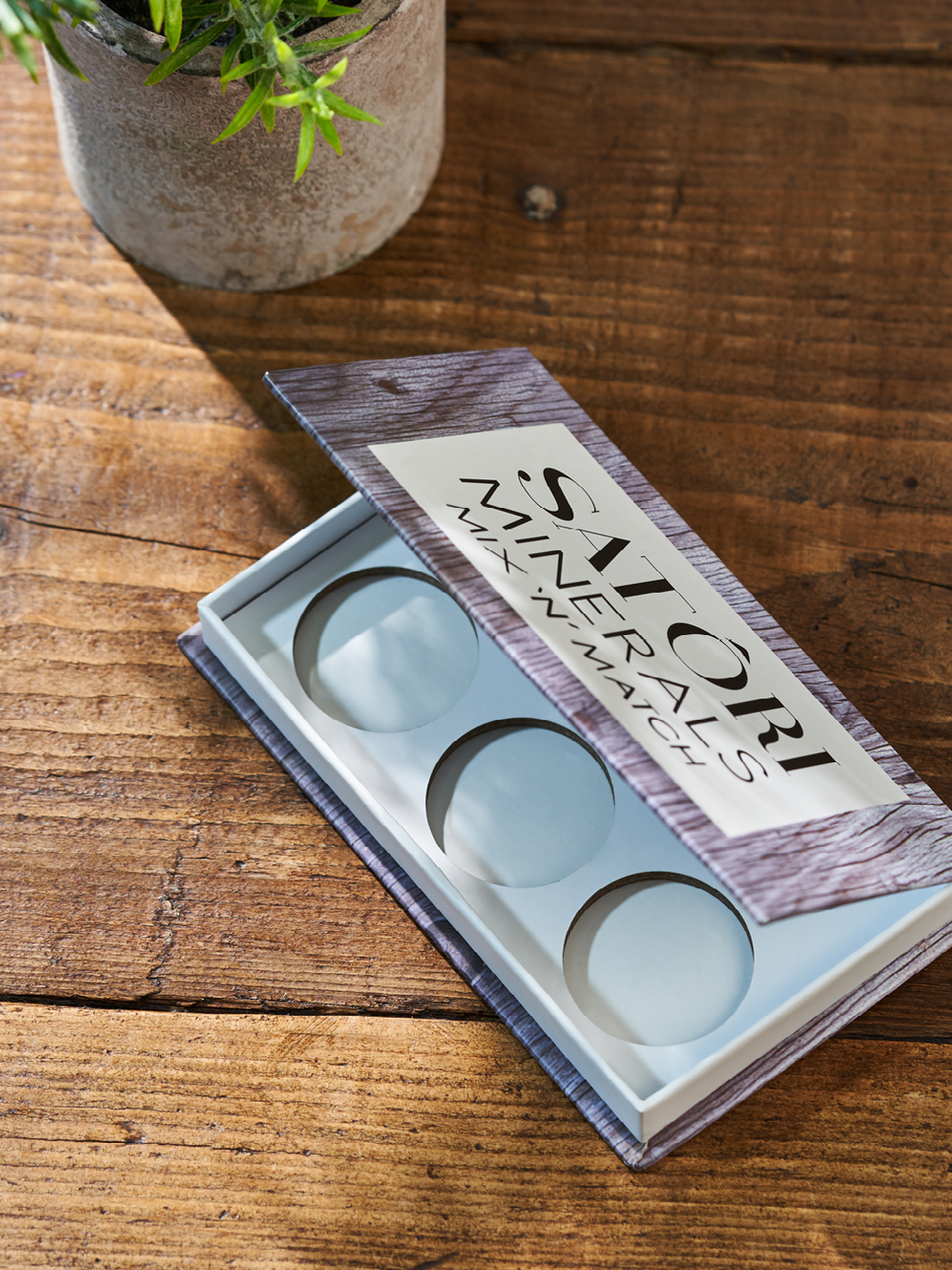 Cosmetic cardboard packaging with punch inserts.