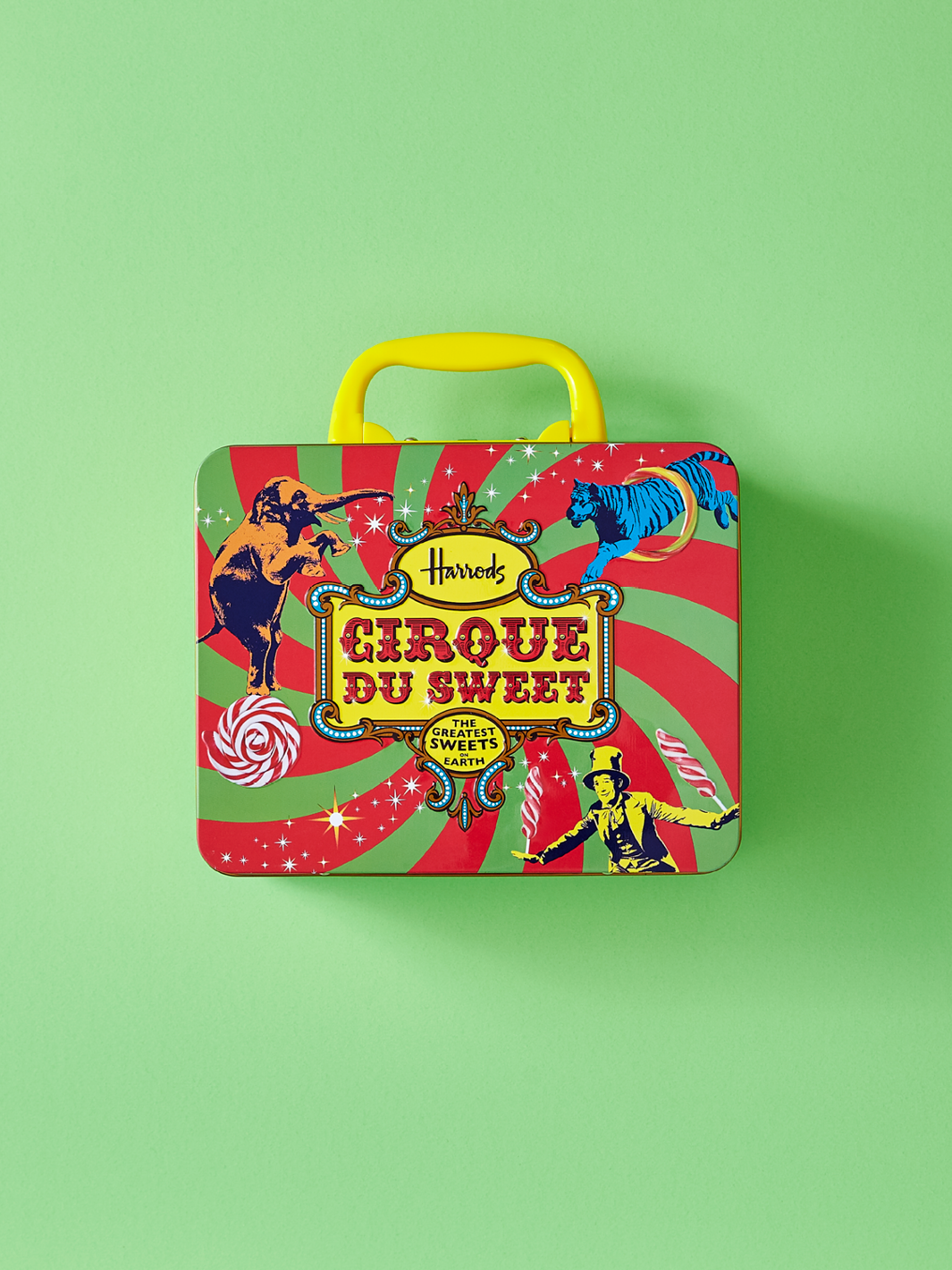 Custom metal tin with a handle on a green background.