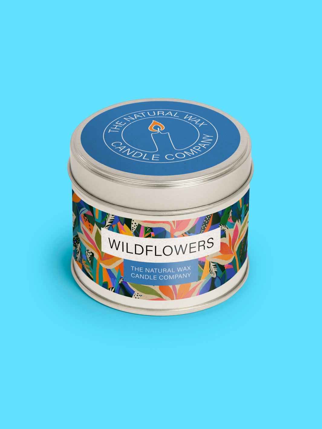 Metal candle tin packaging on blue background.