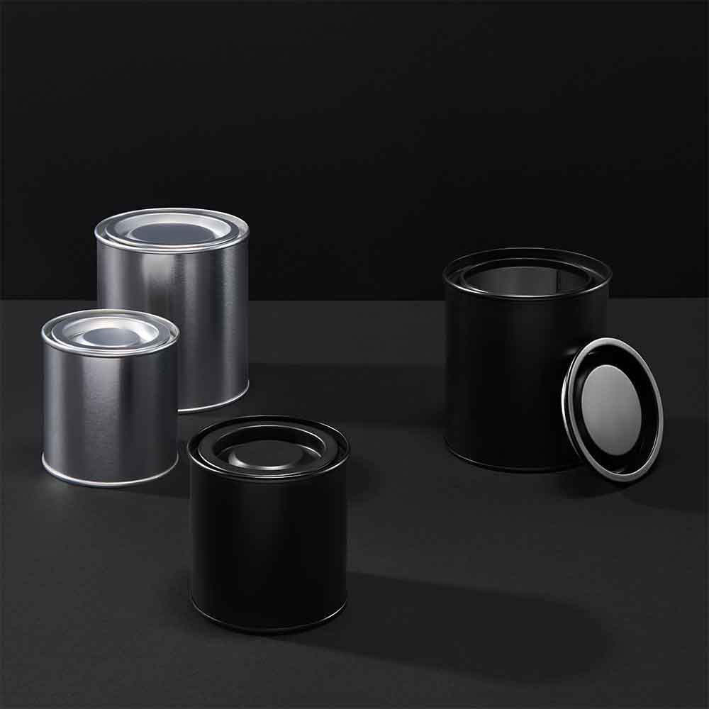 Collection of silver and black lever lid tins on a black background. 